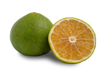 Half and whole of green tangerines on a white background