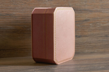 Pink jewelry box on wooden background