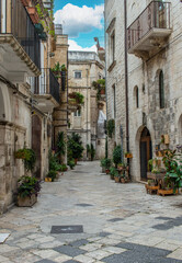 Fototapeta na wymiar Bari, Italy - one of the pearls of Puglia region, Old Town Bari displays a peculiar architecture with its narrow alleyways where it's so easy and wonderful to get lost 
