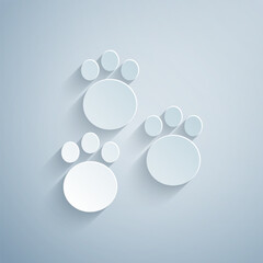 Paper cut Paw print icon isolated on grey background. Dog or cat paw print. Animal track. Paper art style. Vector