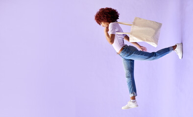 Fashion, shopping and a woman walking on mockup in studio on a purple background for advertising....