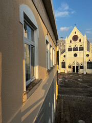 A side-view of an european-style building and a church-like wedding hall nearby in Nanshan district of Shenzhen, China