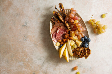 Cheese plate, snacks for wine. Top view, flat lay. Copy space.