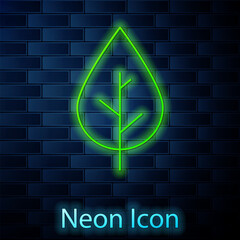 Glowing neon line Leaf icon isolated on brick wall background. Fresh natural product symbol. Vector