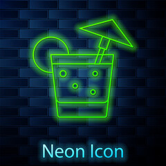 Glowing neon line Cocktail and alcohol drink with umbrella icon isolated on brick wall background. Vector