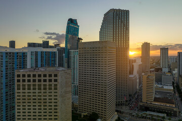 Aerial view of downtown office district of of Miami Brickell in Florida, USA at sunset. High commercial skyscraper buildings and urban traffic in modern american megapolis