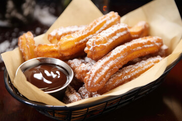 Spanish Churros With Sugar and Chocolate Sauce, Traditional Christmas Dessert - obrazy, fototapety, plakaty