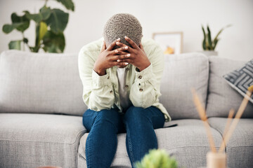 Woman, headache and depression on sofa for mental health, anxiety and stress of bad mistake at home. Crying, sad and frustrated african person scared of trauma, worry and counselling of broken heart