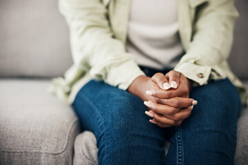 Anxiety, hands and woman on a sofa with stress, fear or worry for mental health or domestic abuse in her home. Psychology, zoom and female with depression, bipolar or scared of gender based violence - obrazy, fototapety, plakaty