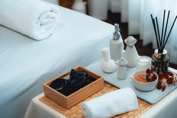 Exquisite display of beauty treatment and spa salon accessories arranged on spa table in luxury spa...