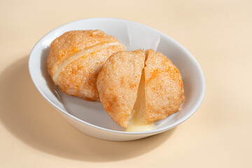 Pempek is a savoury Indonesian fishcake delicacy, made of fish and tapioca from Palembang. Pempek is served with sweet and sour sauce.