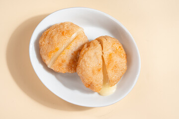 Pempek is a savoury Indonesian fishcake delicacy, made of fish and tapioca from Palembang. Pempek is served with sweet and sour sauce.