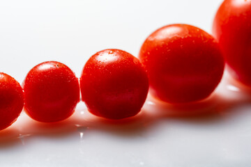 fresh red tomato on white background