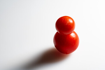 fresh red tomato on white background