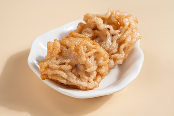 Pempek is a savoury Indonesian fishcake delicacy, made of fish and tapioca from Palembang. Pempek is served with sweet and sour sauce.