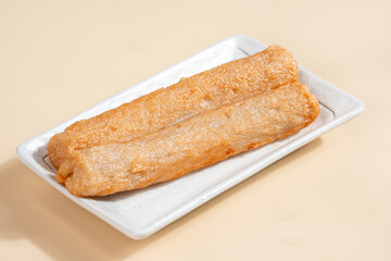 Pempek is a savoury Indonesian fishcake delicacy, made of fish and tapioca from Palembang. Pempek is served with sweet and sour sauce.