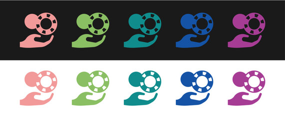 Set Hand holding casino chips icon isolated on black and white background. Casino gambling. Vector