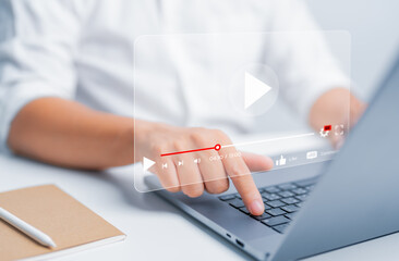 Hand use laptop to watch online video streaming, live content, or movie for relaxing time. Study...