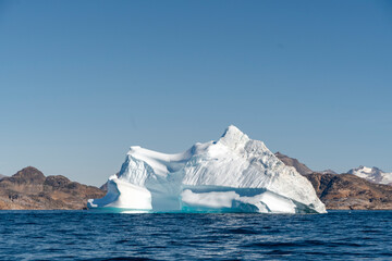arctic iceberg floating on arctic ocean in greenland