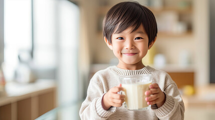 Asian little boy cute kid holding a cup of milk, feel happy enjoy drinking milk in kitchen. Generative Ai
