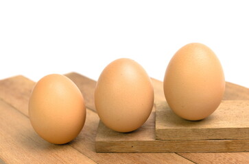 chicken eggs on wooden background