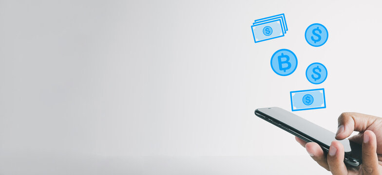 Online Banking,e-commerce,cashless idea.,businessman hands holding smartphone with flying coin and .banknote icon over white background concept for technology,business,financial.
