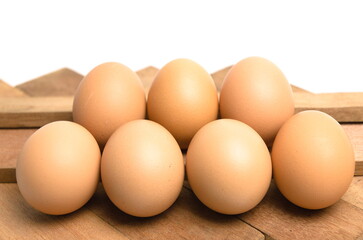 chicken eggs on wooden background
