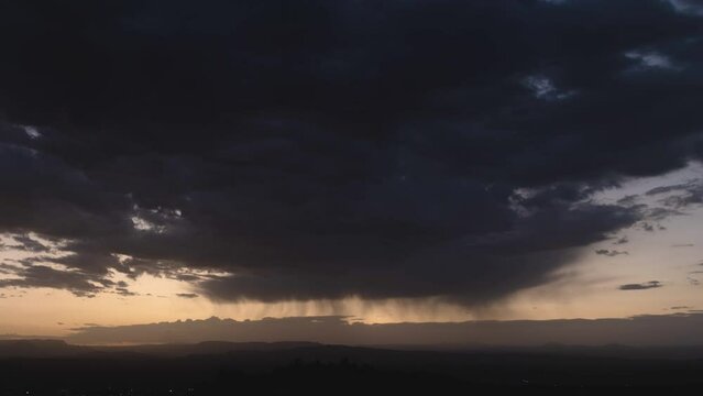 Virga Rain Clouds over Desert Landscape Before Sunrise Timelapse