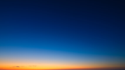 Color gradient on the sky. Sky with clouds during sunset. Clouds and blue sky. Photo for design and background.