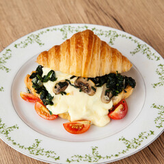Croissant with spinach, champignon mushroom and cheese