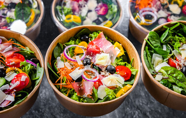 Paper boxes with pre-packaged vegetable salads ready for sale