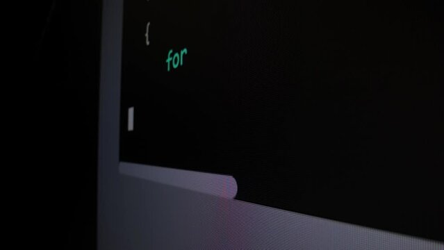 Closeup macro shot movement of coding script moving across LED screen with real-time AI-generated typing, showcasing advanced AI learning in optimization, debug and coding for software development.