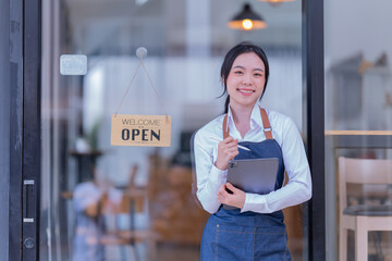 Portrait of Asian woman barista cafe owner. SME entrepreneur seller business concept