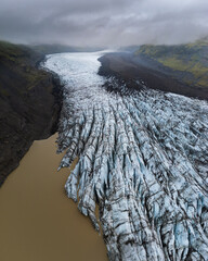 Arial drone view of Svinafell glacier in Iceland, part of Vatnajokull during cloudy day