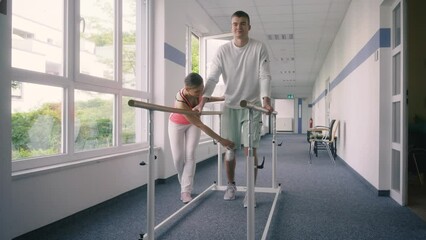 Young man in walking rehabilitation course after a sport injury on his knee
