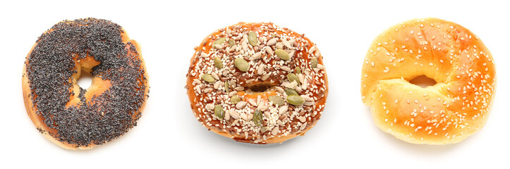 Set of different bagels on white background, top view