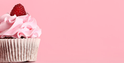 Tasty raspberry cupcake on pink background with space for text, closeup