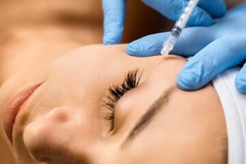 Face Injection for anti aging and bio revitalization effect in beauty salon. Skin care concept. 