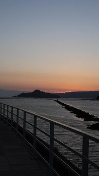 Vertical video of the island of Tambo, in Pontevedra, by a promenade