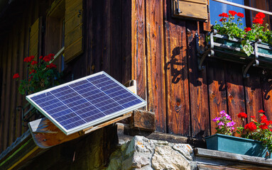 Small solar panel attached to a rural house