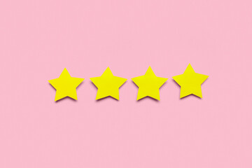 Four stars on pink background. Customer experience concept