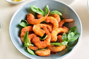 Roasted prawn with basil leaves