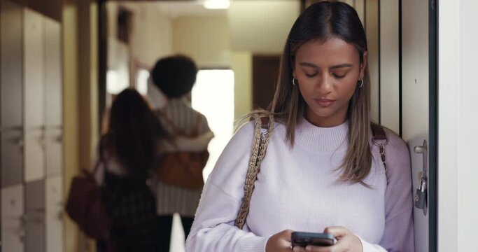 Phone, bullying and gossip with woman in college for social media, sad and contact. Anxiety, outcast and low self esteem with university student at school for rumor, mental health and thinking