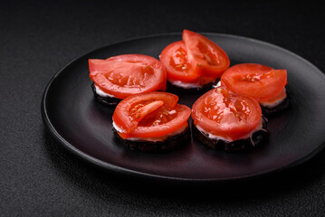 Delicious eggplant cut into circles grilled and cooked with mayonnaise and tomatoes