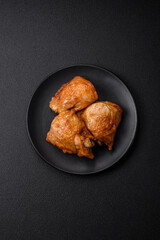 Delicious grilled chicken thighs with salt, spices and herbs