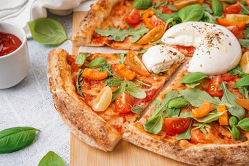 Tasty pizza with Burrata cheese on grey background