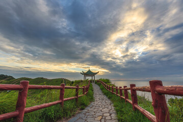 Fototapeta na wymiar pathway by the sea at Tai O Fu Shan Viewing Point during sunset