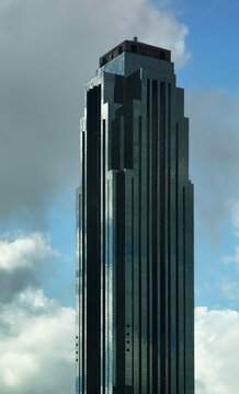 Williams Tower in downtown Houston, Texas against the Blue Sky. The sky is eerily reflected on the building's glass facade.