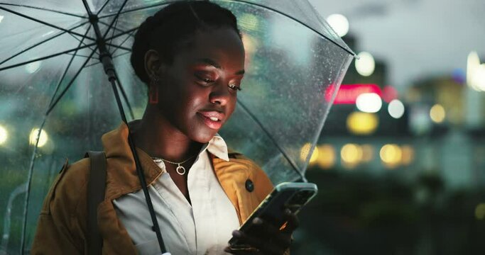 Black woman at night, smartphone and umbrella in city, travel and insurance, ride share app and communication. Commute, social media and using phone to call taxi, security in winter weather and rain