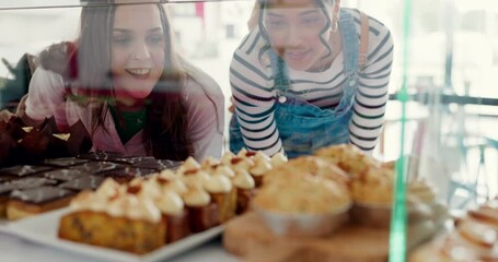 Bakery, shopping and women looking at dessert for a decision, discussion or buying for lunch. Eating, breakfast or friends or a customer at a coffee shop with cake or sweet food in glass for choice
